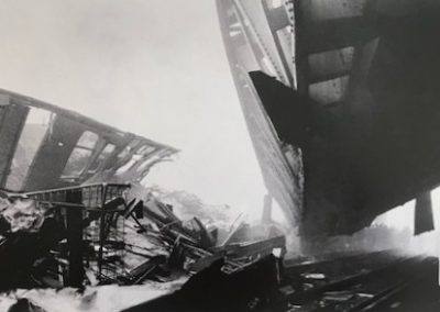 A fearsome sight: the mangled remains of a carriage and the collapsed flyover, pictured in the morning fog.